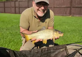 Happy fisherman with Carp.png 84
